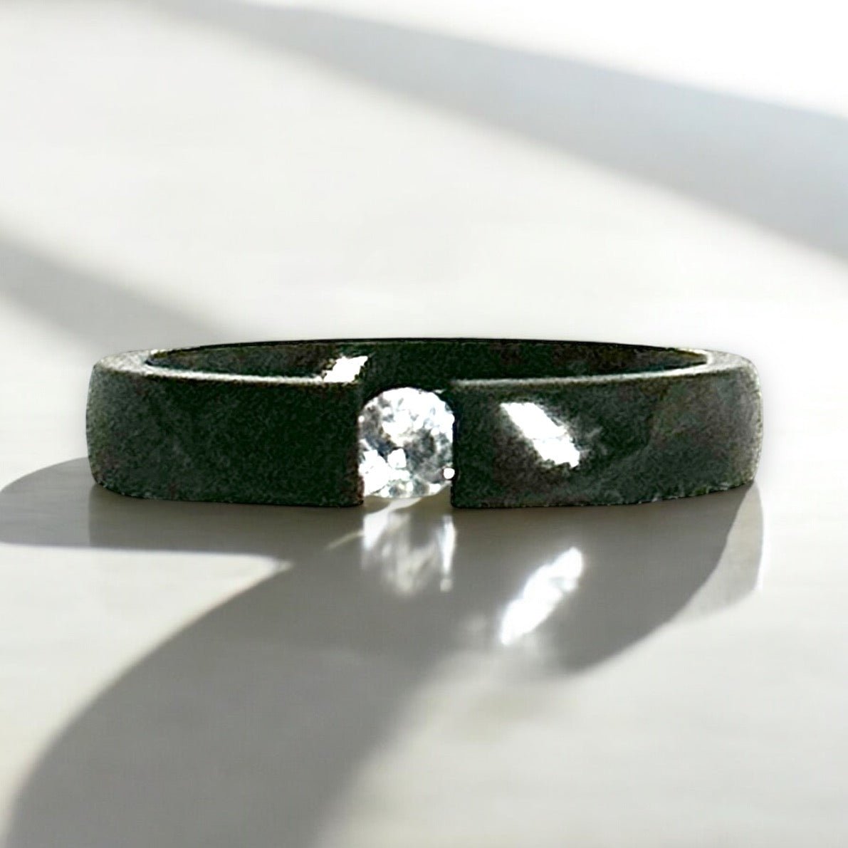 Minimalist Black Stainless Steel Gap Ring with Simulated Diamond Accent

Description:
This exquisite ring features a modern black stainless steel band with a bold open-gap design, showcasing a stunning simulated diamond centerpiece. The perfect ble